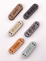 Custom Ultrasuede Tags - Rounded Rectangular - Sew On - 1.75 x 0.5 in.
